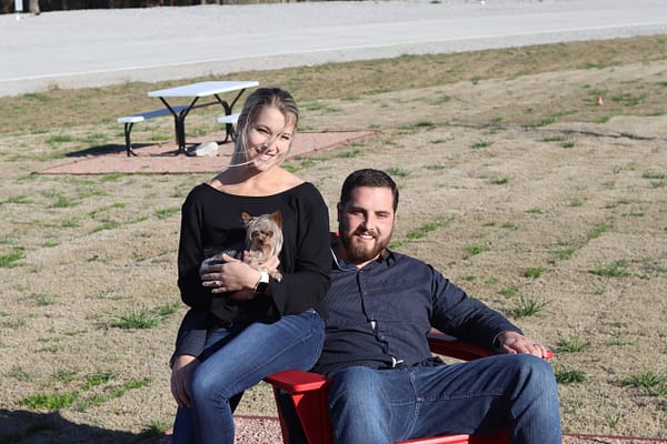 young couple with dog at rv park paradise tx